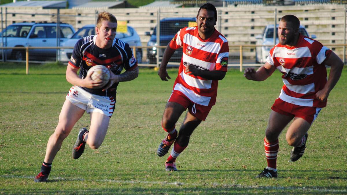 • Rooster Blake Robinson makes a strong run during Bega’s 32-16 win over the Narooma Devils on Sunday.