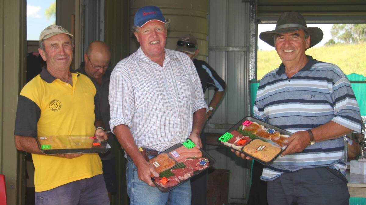 • These three smiling faces purposely missing a shot in the Bega Gun Club raffle just to pick up a meat tray are (from left) Phil Craig, Peter Johnston and George Adamopoulos.