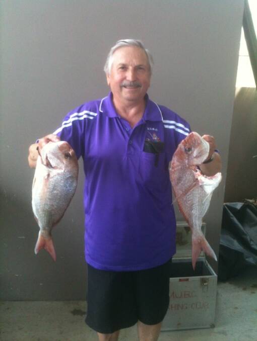 DOUBLE THE CATCH: Les Toth displays his two fish 