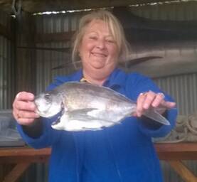 KEEN ANGLER: Culburra Fishing Club’s Margaret Roth displays a fish she caught in last month’s competition. 