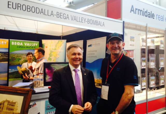 Promoting the South East to prospective new residents at the NSW Country Expo is Bega Valley Shire Council business growth coordinator Bob McAlister (right) with NSW Shadow Minister for Regional Development Mick Veitch.