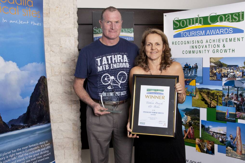 Tathra’s Andrew Johnson and Jane Corben proudly show off Tathra Beach and Bike’s 2012 South Coast Tourism award.