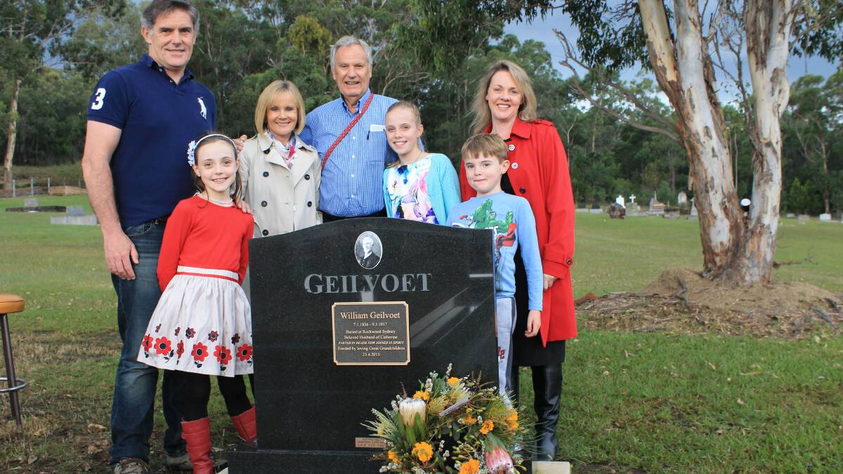 The Coggan family of (from left) Paul, Bronte, Elizabeth, Peter, Eliza, Jack and Melissa stand behind a recently erected memorial to their ancestors William and Catherine Geilvoet in Cobargo Cemetery. 