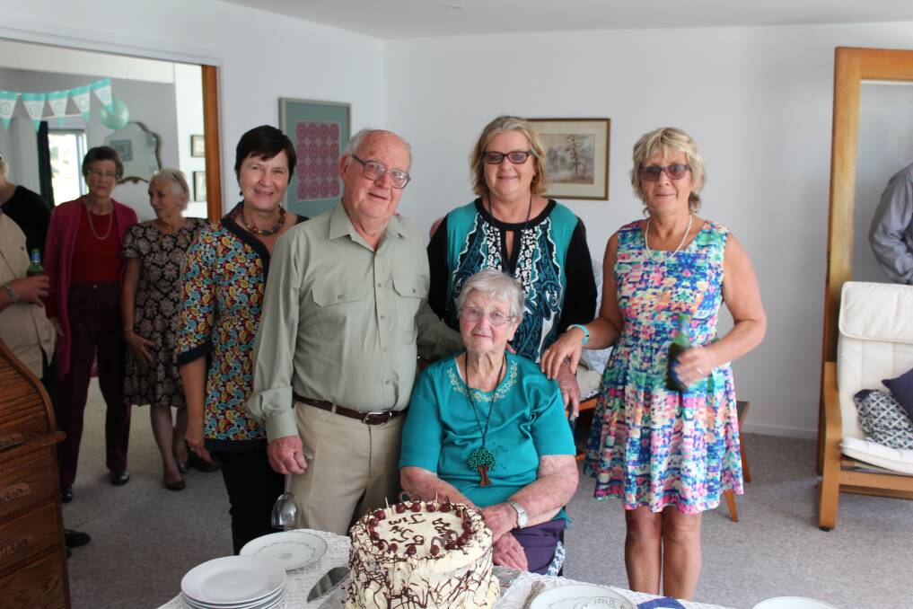 Jim and Moira Collins prepare to cut the cake at their 65th wedding anniversary party, with their daughters (from left) Beth, Nicky and Jenny. 
