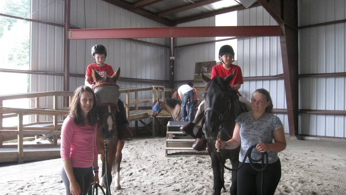 Kaitlin (far right) volunteering with special needs children at a ranch in Canada.
