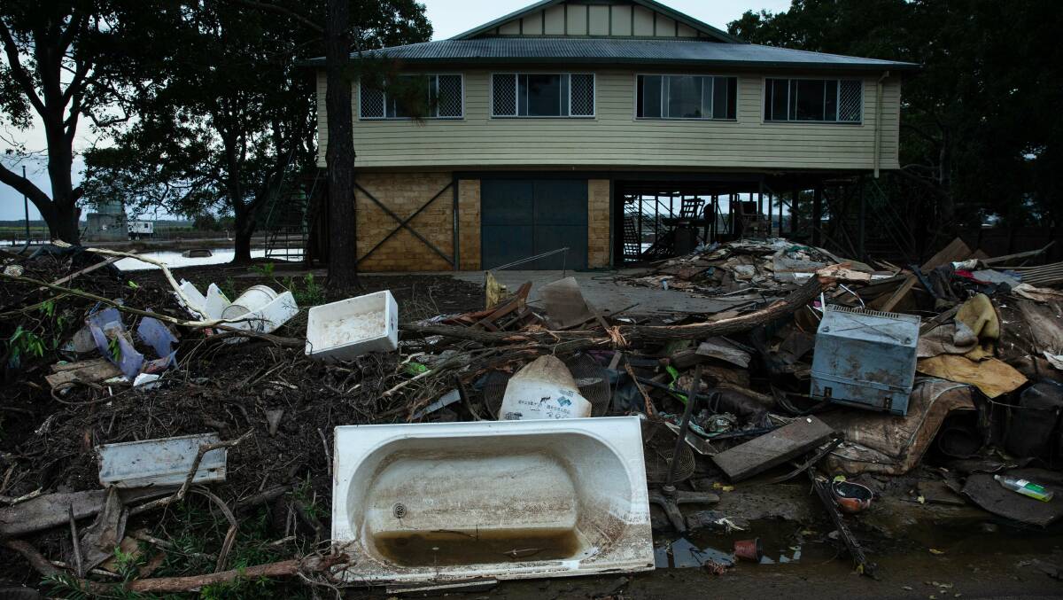 The contents of a flood ravaged home await removal in Woodburn. Photo: Marina Neil.