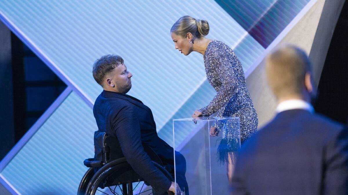 Australian of the Year Dylan Alcott (left) greets 2021 title holder Grace Tame. Picture: Keegan Carroll