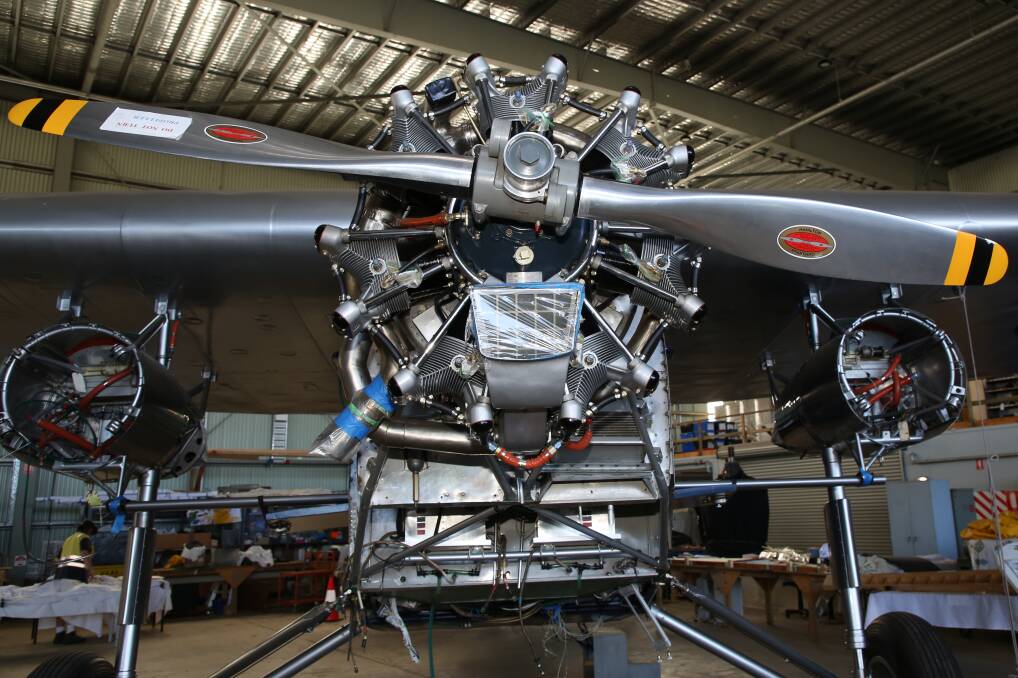 Job almost done: The front engine has been reconditioned and fitted on the front of the Southern Cross II the other two engines will arrive within days and be installed in their housing below the giant mono wing. 