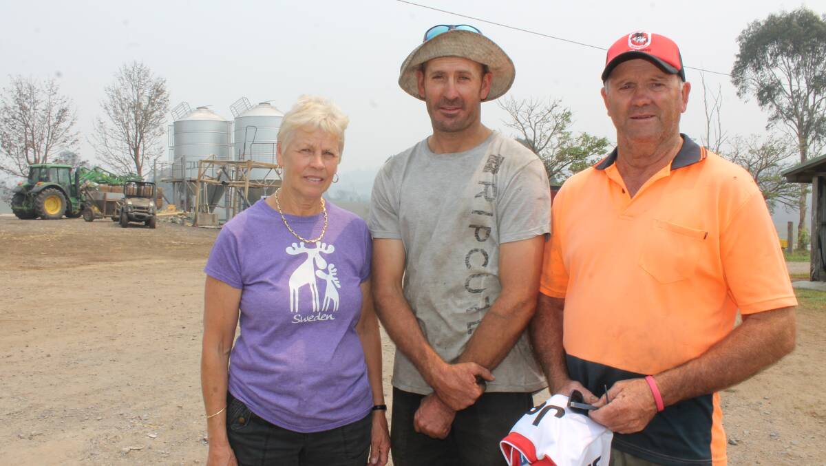 Margaret, Brett and John Jessop at their Coolagolite dairy farm in February 2020, in the aftermath of the Black Summer fires that devastated their property.