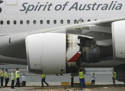 Technicians look at the damaged engine of Qantas Airways A380 passenger plane QF32 after it was forced to make an emergency landing at Changi airport in Singapore November 4, 2010.