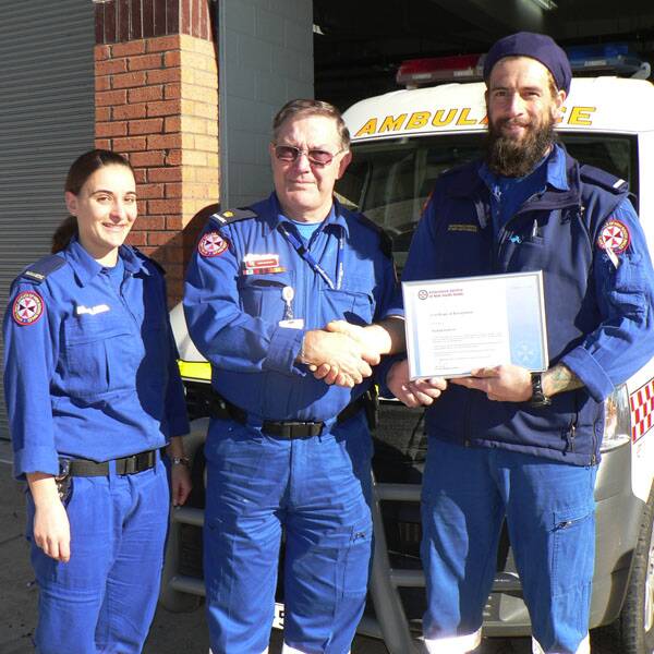 Fellow Bombala Paramedic, Katherine Allen and Inspector Bob Whitney congratulated Paramedic Nathan Roberts on receiving a Certificate of Recognition last Thursday for his vital logistics role in a fatal accident near Pericoe in 2007.