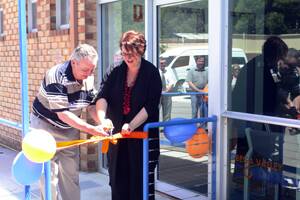 • One of the longest serving volunteers at BVCTS, Jeff Thornton, and Penny Sharpe cut the ribbon at the official opening of the Community Transport building.