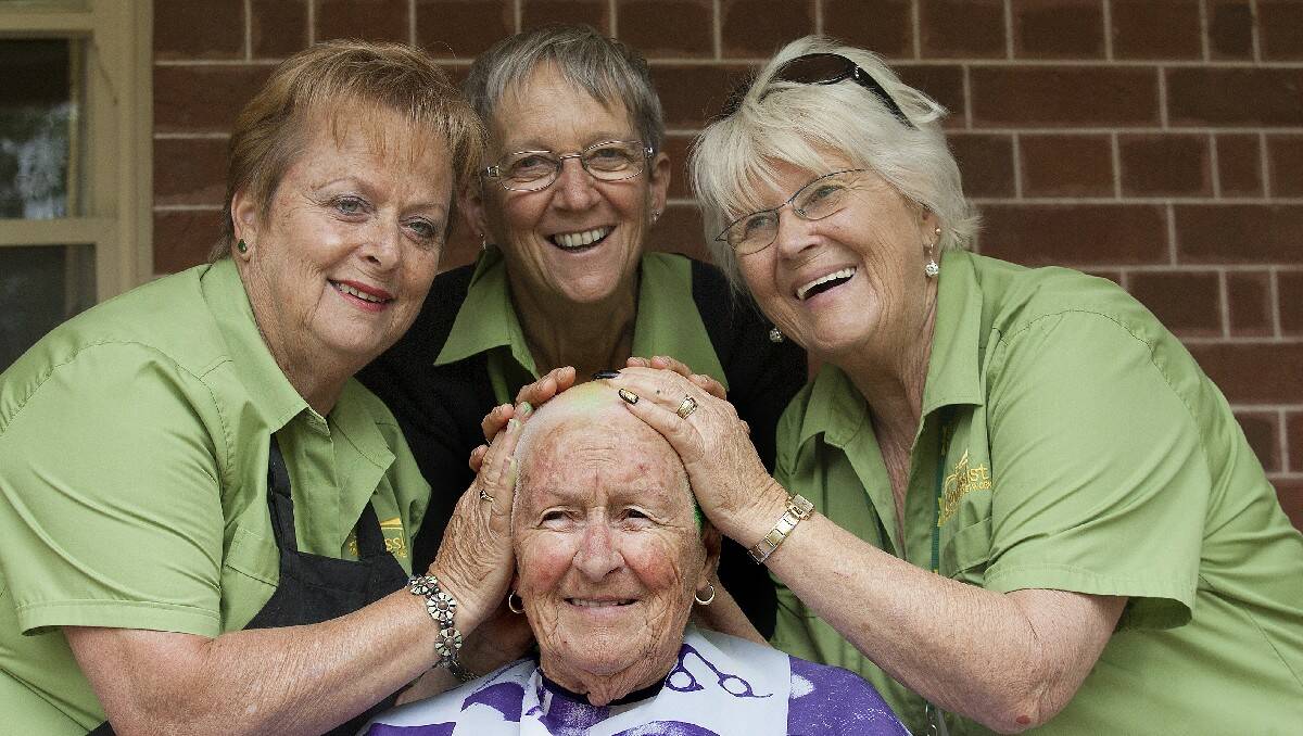 Can Assist members (from left) Rhonda van Bracht, Beth Collins and Kay George admire their work as Shirley Watson, 72, shows off her newly shaven head. The shave raised more than $6000 for the cancer support charity.
