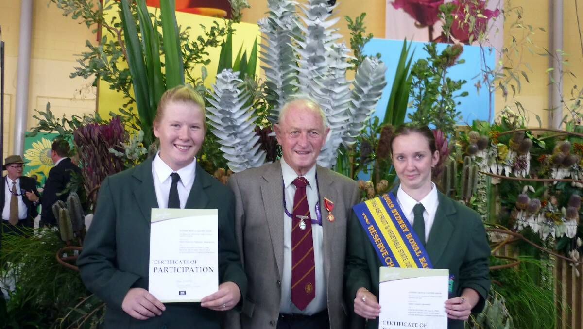 Ray Sawtell attends the Sydney Royal Easter Show in 2012 with Bega Valley students Vicki Sbresni Robinson and Vashti Herbert.