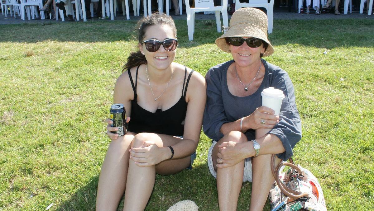 Canberra's Georgina Coggins and Mady Green enjoy a quiet drink at the Sapphire Coast Turf Club.