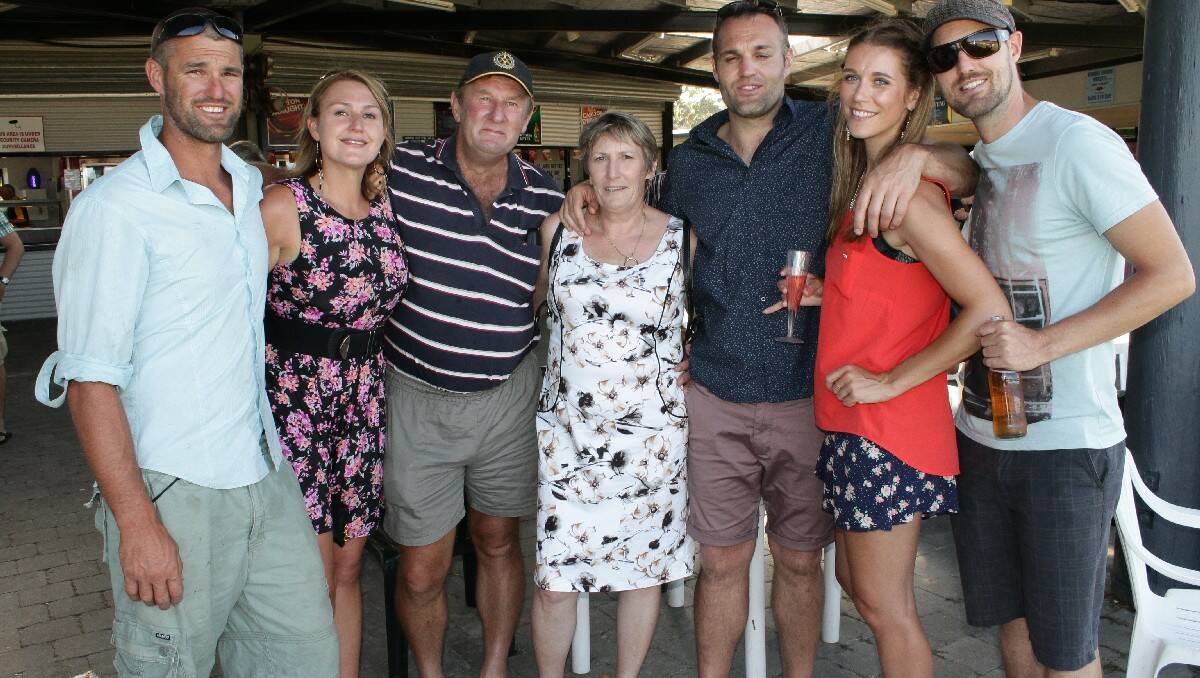 Enjoying the social aspect of the Bega Cup races are (from left) trainer Grant Bobbin, Michelle Bobbin, Norman and Wendy Wilton, Andrew Bobbin, Charlotte Priestley and Glen Bobbin.