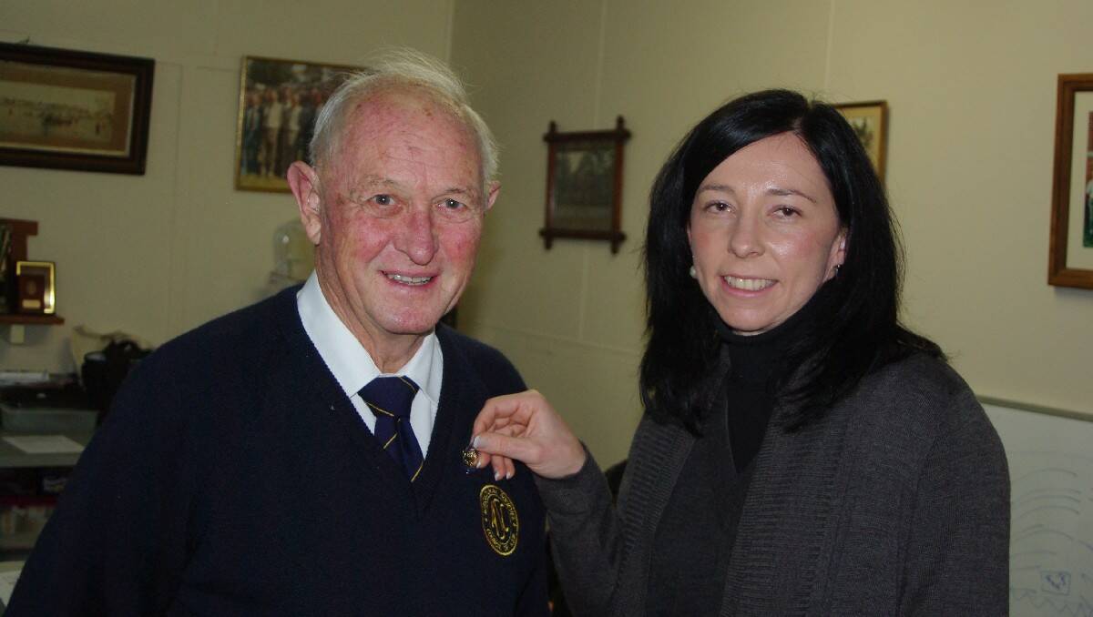 Ray Sawtell receives a life membership pin from Julie Schofield, delegate to the Agricultural Societies’ Council.