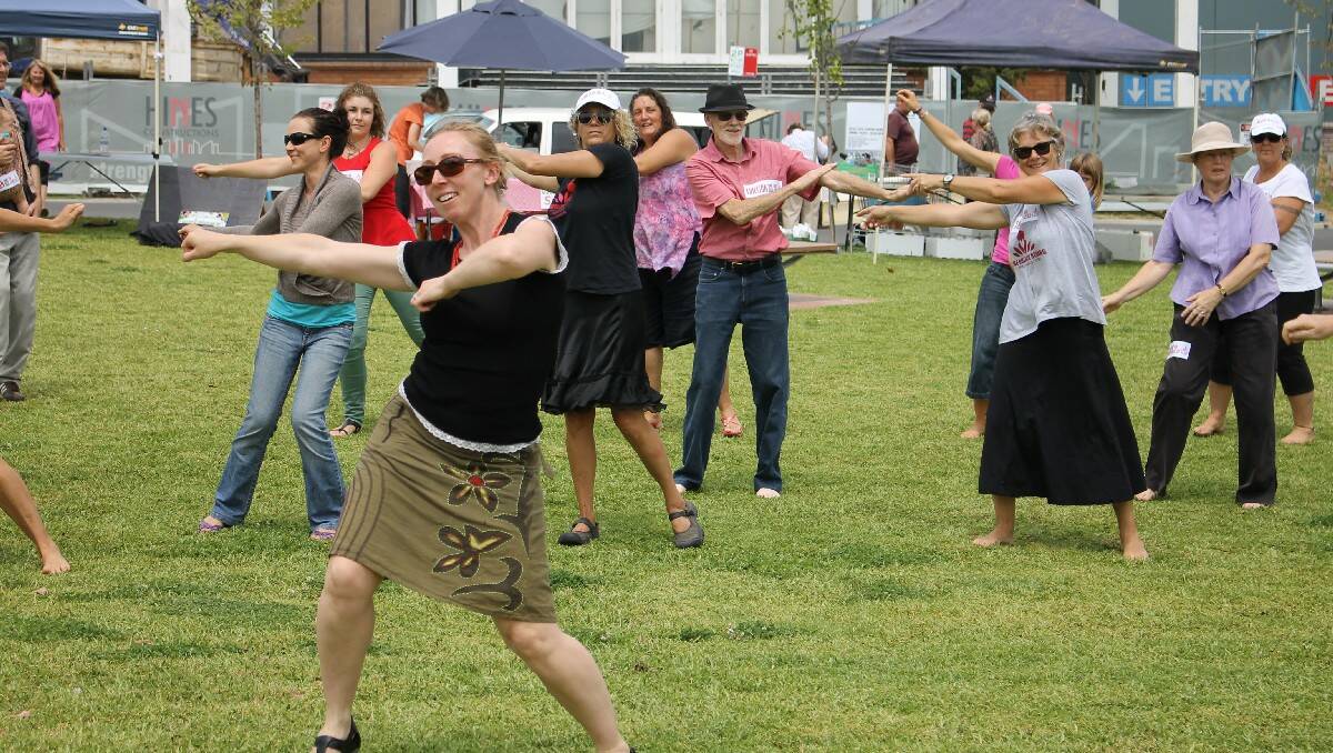Participants take part in the “One Billion Raising for Justice” flash mob in Bega on Friday.
