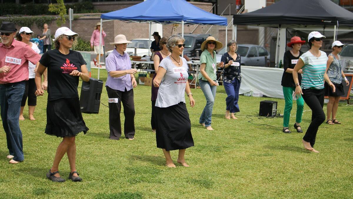 Participants take part in the “One Billion Raising for Justice” flash mob in Bega on Friday.