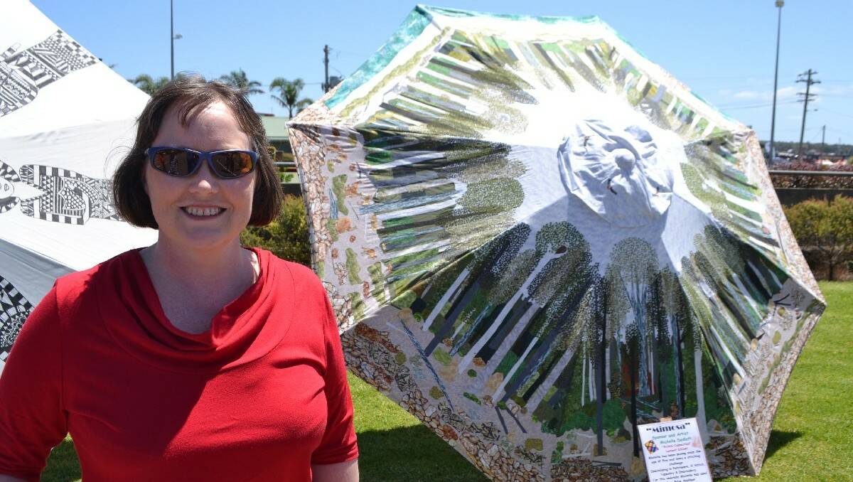 Local artist and business owner Michelle Dedlefs intricate, hand-stitched umbrella impressed the crowd and Catriona.