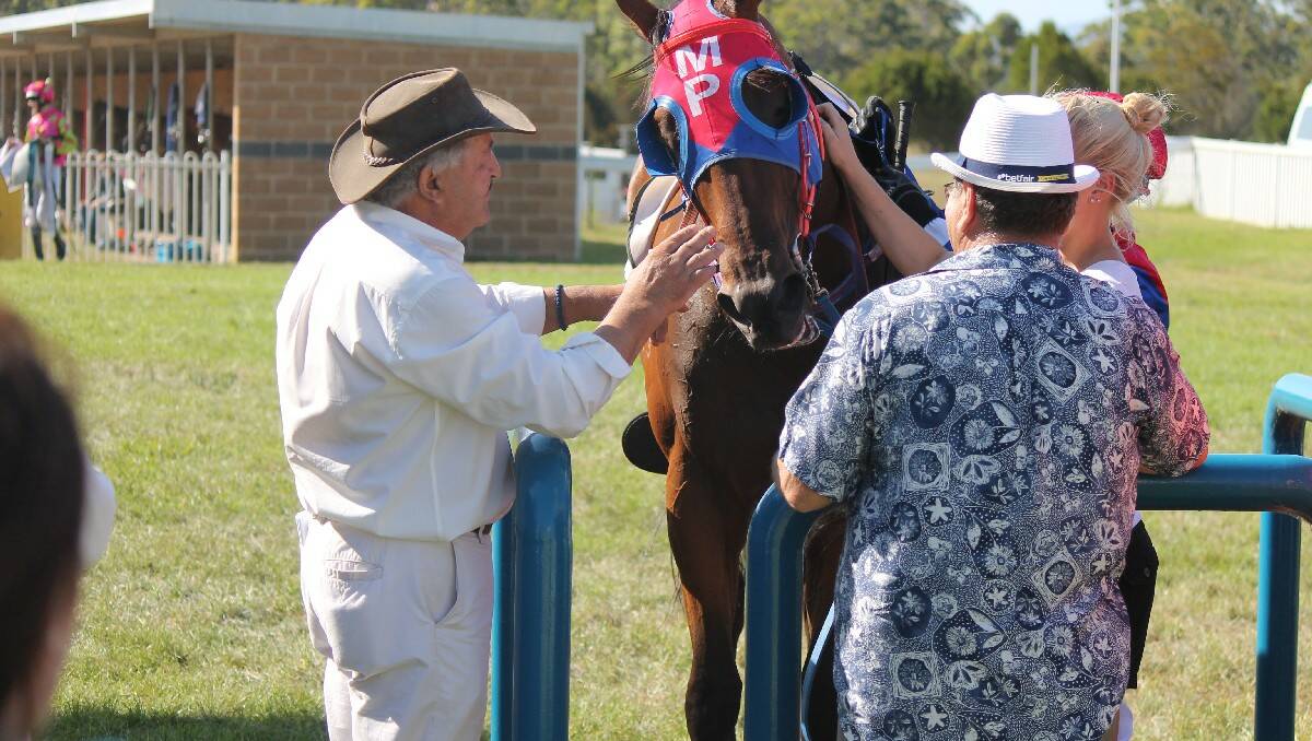 Laurie's Love is congratulated by his support crew after winning the $35,000 Bega Cheese Bega Cup race on Sunday.