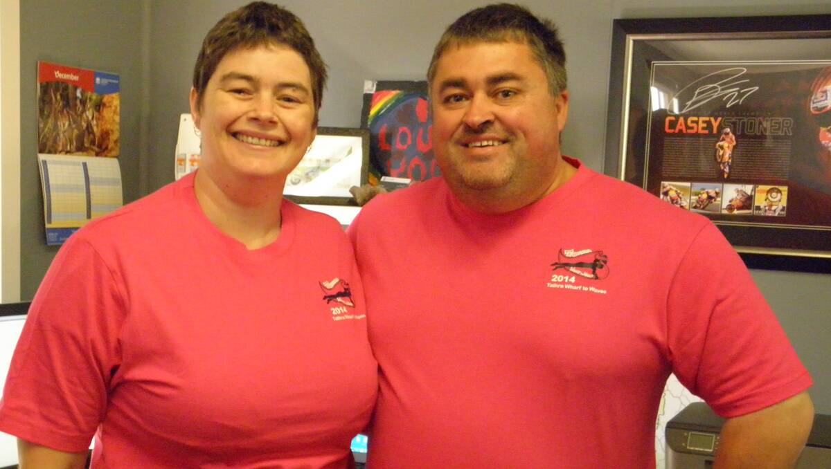 EnviroKey owners Linda and Steve Sass show off their specially designed Tathra Wharf to Waves shirts.