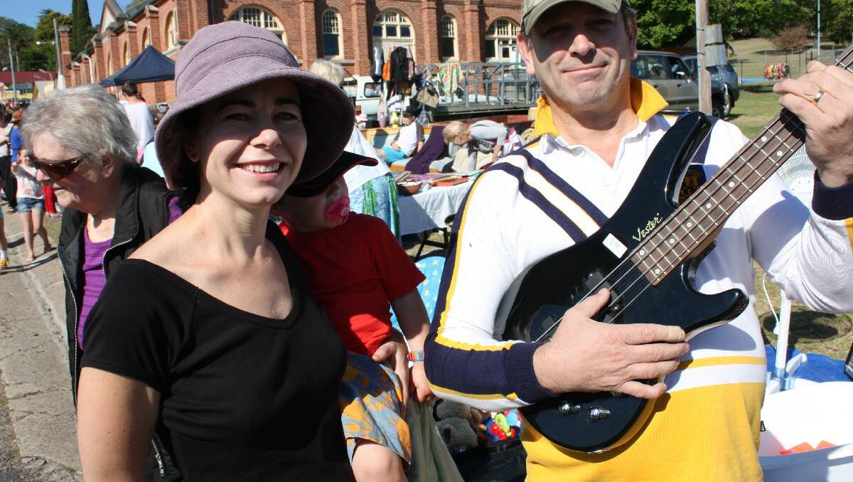 David Williamson sounds out stallholder Ann Smith for her best price on an electric guitar.