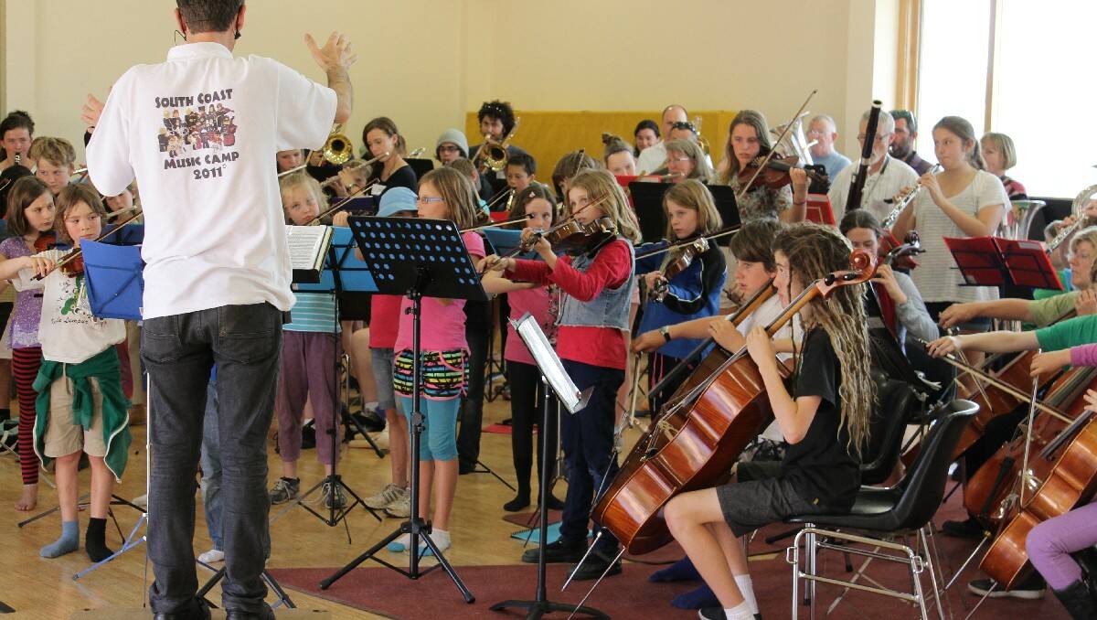 Geoffrey Badger leads a group practice session during the annual South Coast Music Camp.