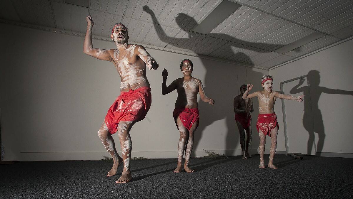 Shaquille, 18, Cohen, 13, and Brytan Aldridge, 12,  with Warren Foster on didgerdoo, all from Eden, perform at the Contemporary Indigenous Exhibition opening at Bega Valley Regional Gallery.