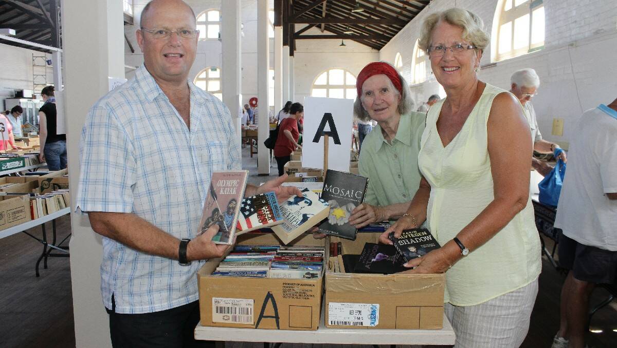 Setting up for the 2013 January Rotary Book Fair are (from left) club members Jeff Tipping, Anna Senior and Jan Southcott. Rotary is hoping its 2014 fair matches the success of last year. 