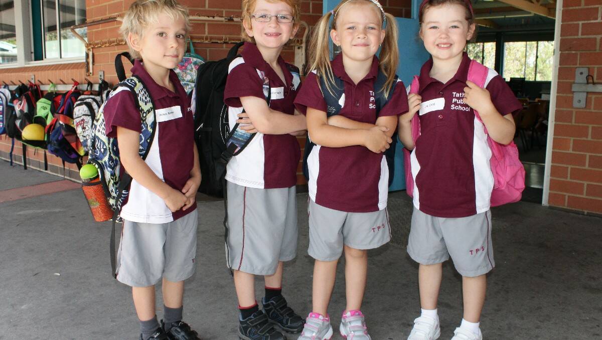 Grabbing their school bags and starting their journey at Tathra Public School are Kindergarten pupils (from left) Henry Baxter, Cooper Finnegan, Mia Brown and Lani Child.