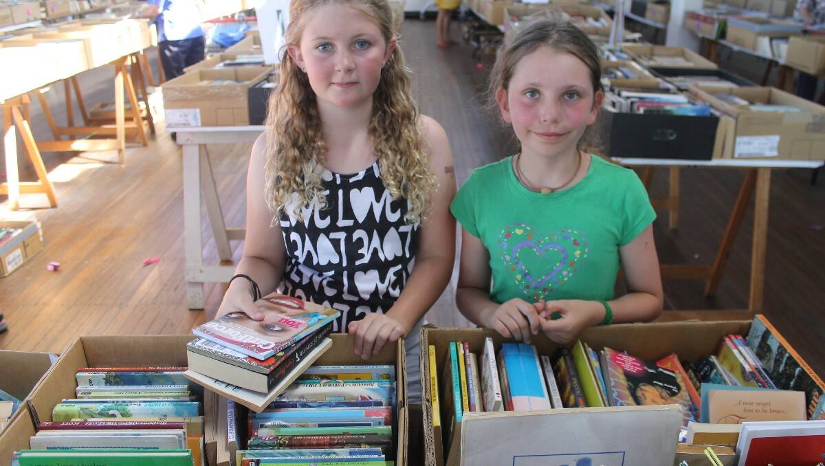 Canberra visitor Danielle Howse and Gracie Broadbent of Bega check out the great reads available for younger people.