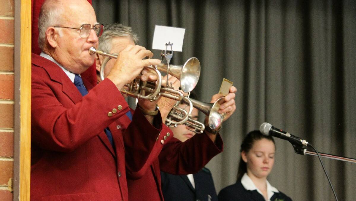 Terry Twyford and Ray Barling from the Bega District Band perform The Last Post.
