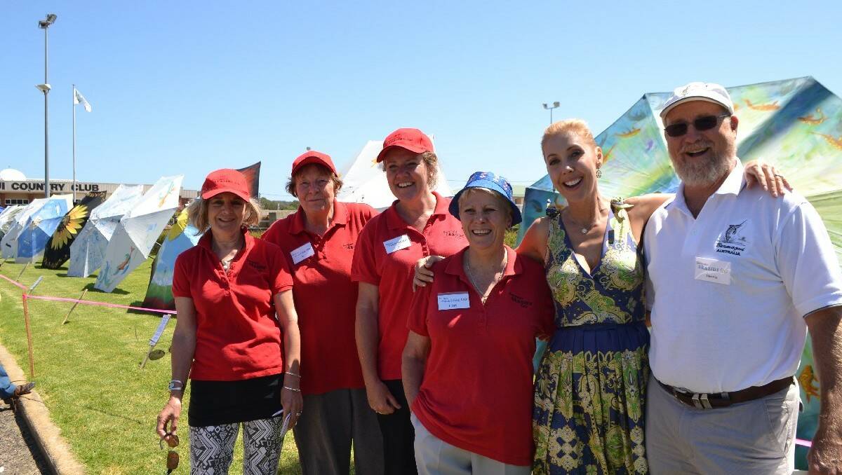 Bermagui Seaside Fair committee members Denise Page, Bev Fleming, Jo Jacobs and Lori Hammerton with Catriona Rowntree and the coordinator of the Umbrellas of Bermagui event Dennis Olmstead.