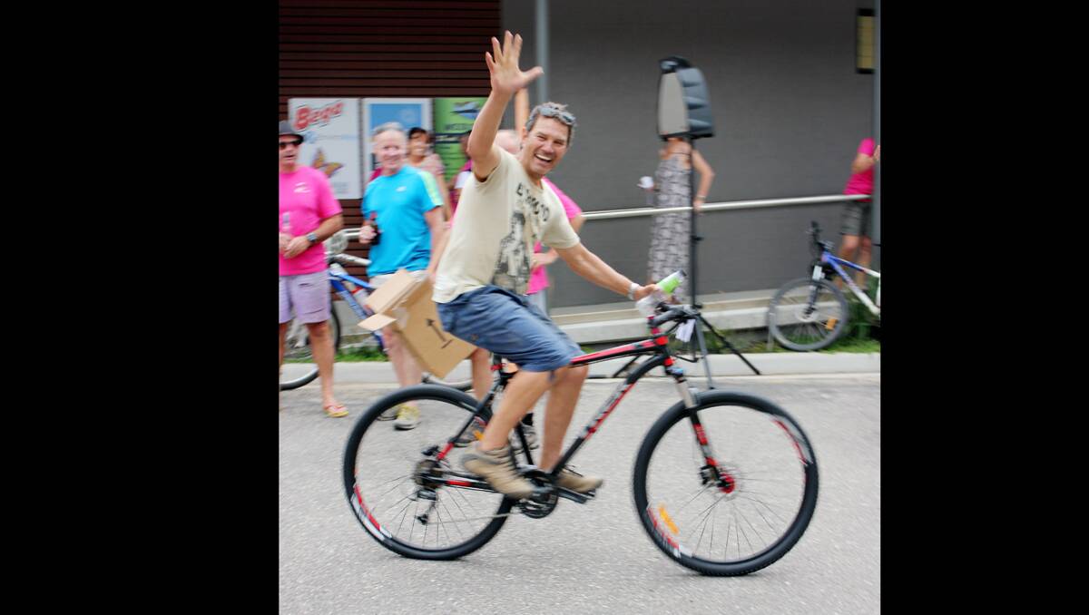 An ecstatic Ian Rich emerges from the crowd to claim his new mountain bike on Saturday.