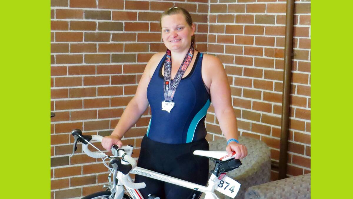 • Formber Bemboka woman Chantelle Lloyd shows off her second place medal after competing in a triathlon at Nowra last week. 
