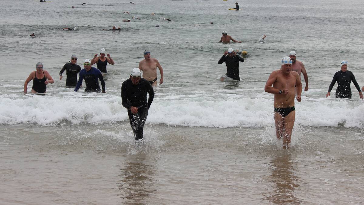 Action from the 13th annual Tathra Wharf to Waves on Sunday morning. 