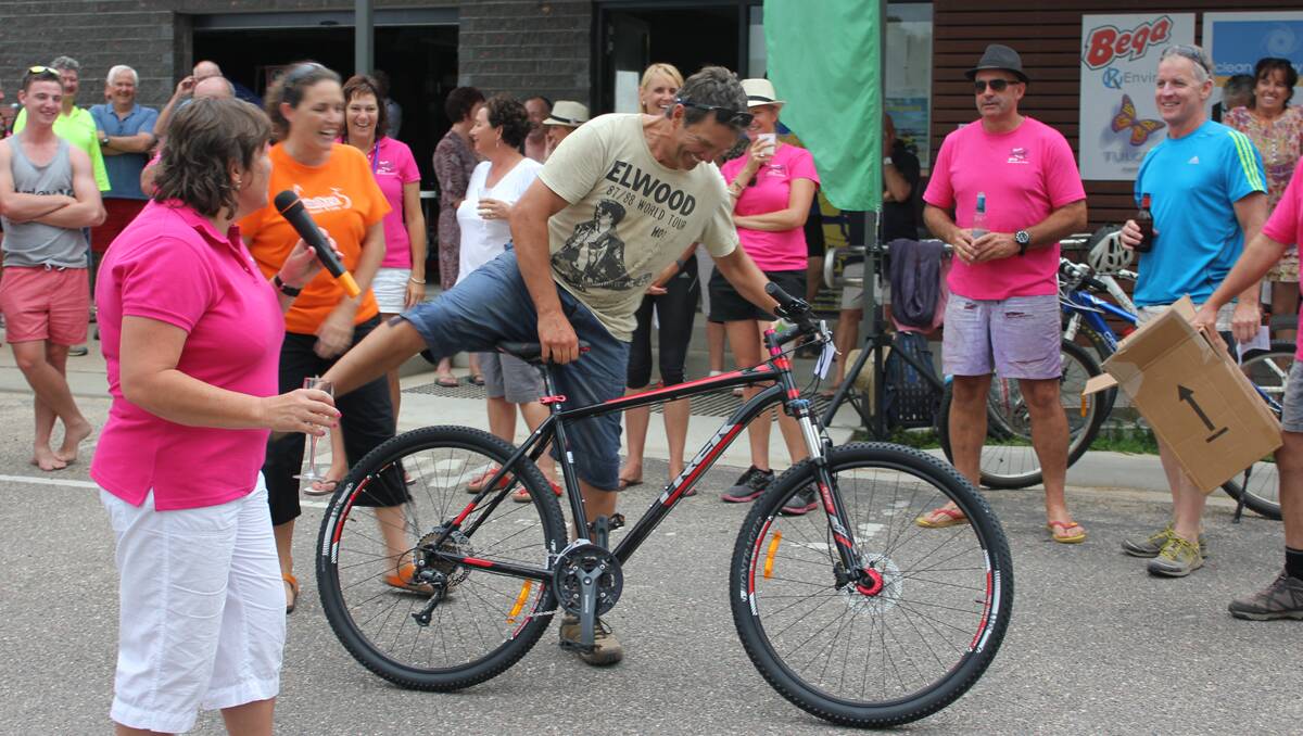 An ecstatic Ian Rich emerges from the crowd to claim his new mountain bike on Saturday.