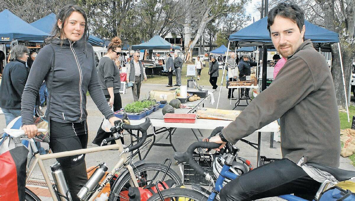 Melbourne couple Sophie Chishkovsky and Greg Foyster visit the SCPA market in Bega on Friday as part of their 4000km Australian East Coast cycling tour, researching for a book about “simple living”. 