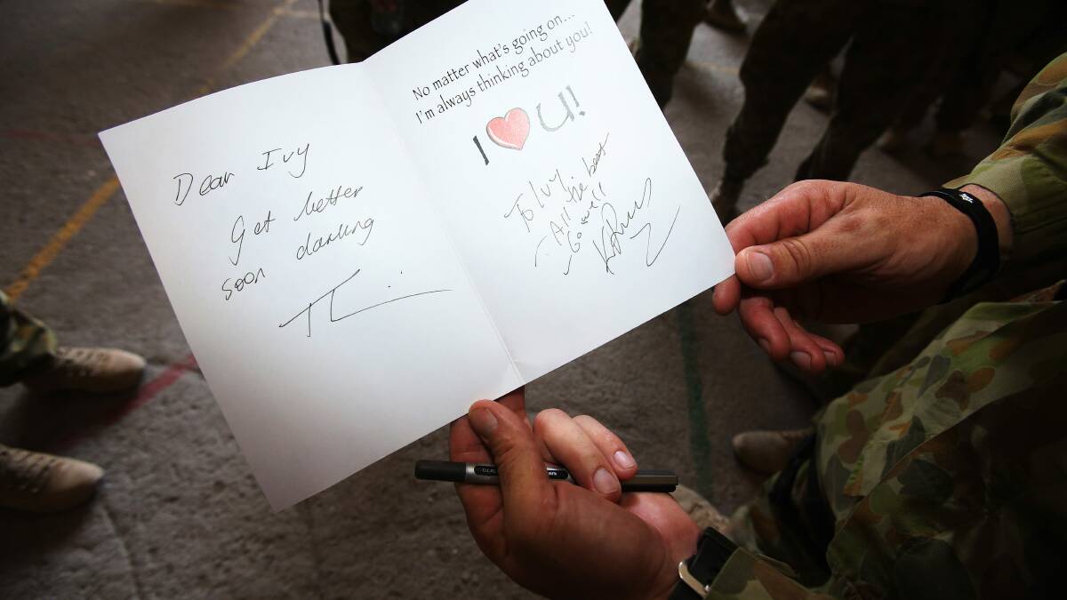 The get well soon card signed by Kevin Rudd. Photo: Gary Ramage/pool