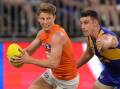 GWS star Lachie Whitfield (left) is confident he can cope with being tagged. (Richard Wainwright/AAP PHOTOS)