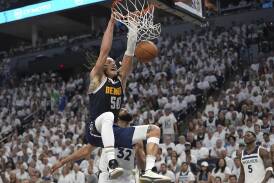 Standout Aaron Gordon dunks for Denver in their series-levelling win over Minnesota. (AP PHOTO)